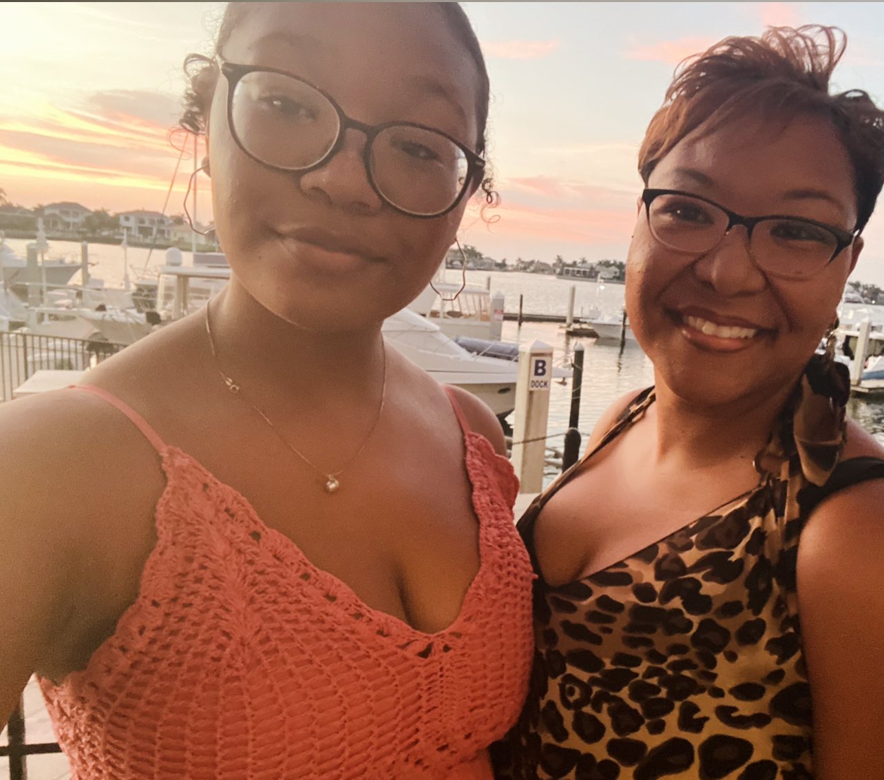 Betty with her daughter Grace at sunset on the dock